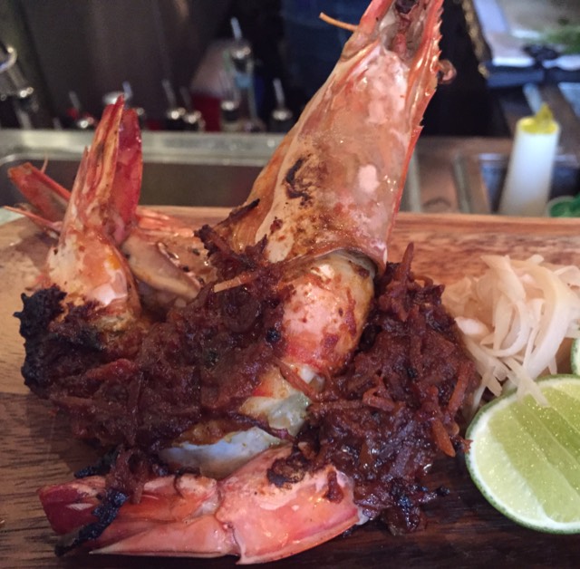 Goong Golae - whole tiger prawn smothered in dry red coconut curry, grilled over fire with pickled ginger and lime from Chachawan on #foodmento http://foodmento.com/dish/32186
