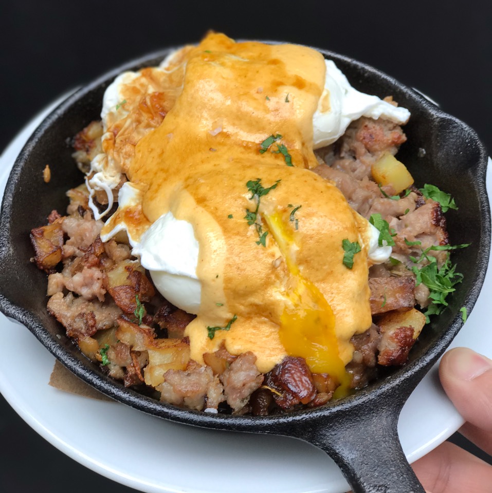 Hangover Hash (Fennel Sausage, Poached Eggs, Cholula Hollandaise, Duck Fat Onions) from Trademark Taste & Grind on #foodmento http://foodmento.com/dish/41999