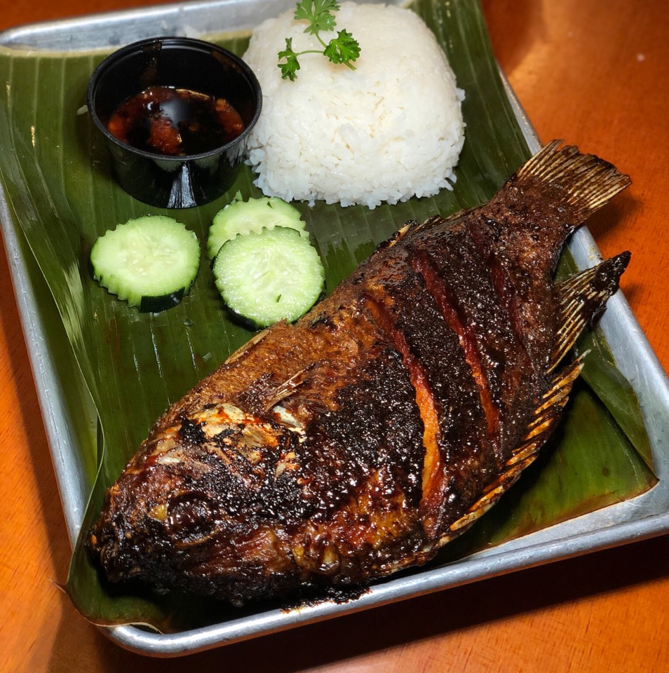 Grilled Fish (Ikan Bakar) - Flash Fried Then Grilled Tilapia, Special Soy Garlic Sauce from Simpang Asia on #foodmento http://foodmento.com/dish/46903