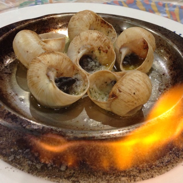 Escargots Baked With Garlic Butter from Ma Maison Restaurant on #foodmento http://foodmento.com/dish/5166