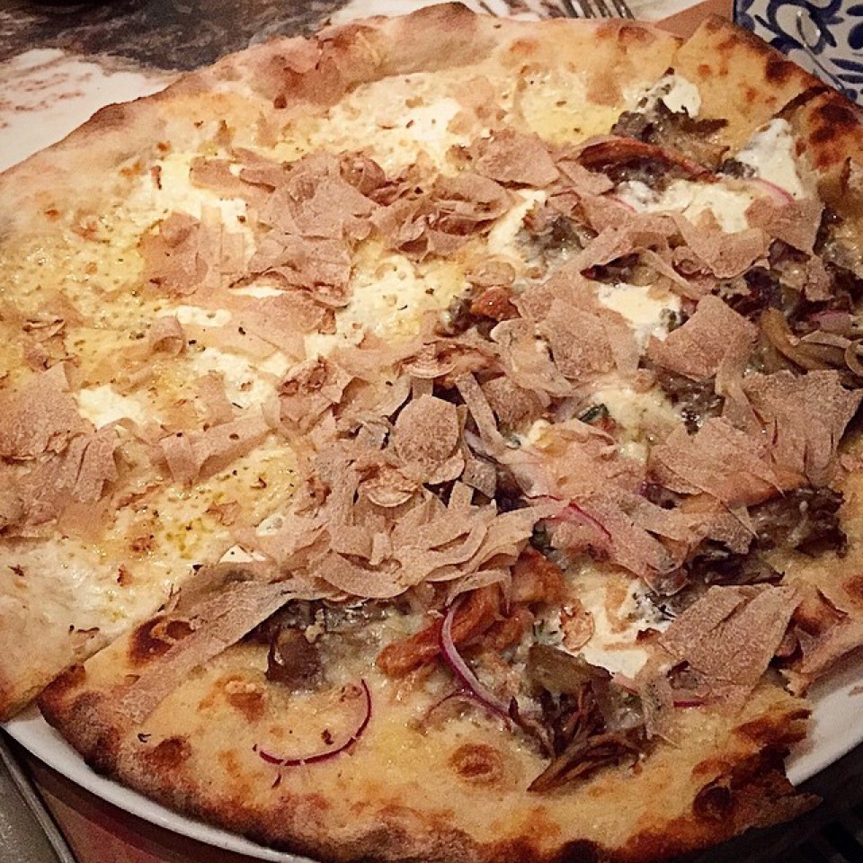 Pizza (Half Tartufata, Half Funghi + White Truffle Shavings) at Marta (CLOSED) on #foodmento http://foodmento.com/place/4387